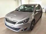 the silver car is parked in the garage of the building