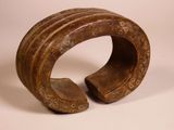 an image of a wooden sculpture of a ring with holes in it