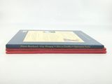 two books sitting on top of each other on a table