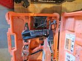 a person standing next to a tool box with tools in it