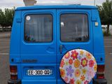 a blue van with a flowered sticker on the back