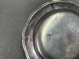 a silver plate that is sitting on a table