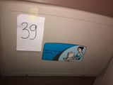 a sticker on the side of a refrigerator with a picture of a woman on it