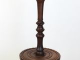a lamp that is on top of a wooden table