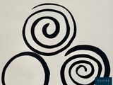 a black and white drawing of three spirals on a white surface