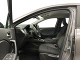 the interior of a car with the door open and the driver ' s seat down