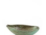 green ceramic bowl with legs on a white background