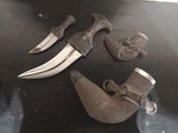 two knives that are sitting on top of a table