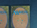 two decks of magic the gathering are shown on a table
