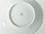 a white plate with a blue and white design on it