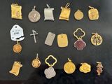 many different types of charms on display in a glass case