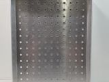 stainless steel tray with holes and rivets on a white surface