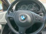 steering wheel and dashboard of a car in a parking lot
