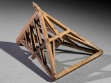 a wooden object that looks like a triangular structure