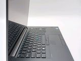 a laptop computer sitting on top of a white table