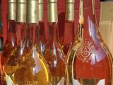several bottles of wine are sitting on a shelf in a store