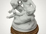 an image of a statue of a boy and a girl on a rock