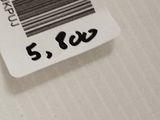 a close up of a cell phone with a barcode on it