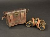 two old binoculars sitting next to each other on a table
