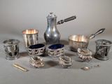 a lot of silver items that are on the table