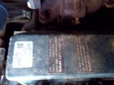 an image of a car engine with a box of oil on it