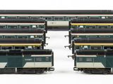 four trains that are sitting next to each other on the tracks