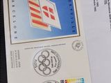 a close up of a postcard with a picture of the olympic rings on it