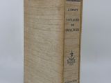 an old book sitting on top of a white surface