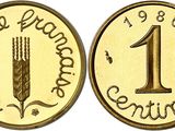 a close up of a coin with the number one on it