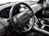 a car dashboard with a steering wheel and a dash board