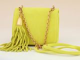 neon yellow tasselled clutch bag with chain strap