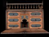 an old wooden dresser with many drawers on it