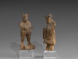 paire de personnages en bois sculpté représentant un homme et une femme