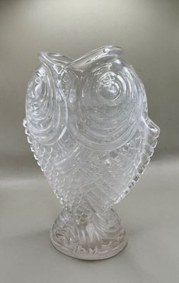 a clear glass vase with an owl design on it