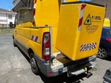 a yellow truck that is parked in a parking lot