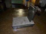 a small scale sitting on the floor in a room