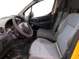 the interior of a small van with a steering wheel and a dashboard