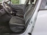 the interior of a car with the door open and the driver ' s seat down