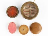 three different types of wooden knobs on a white surface