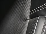 a close up of a black and white photo of a car seat