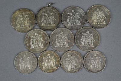 six different types of coins are arranged on a table