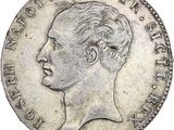 Gros plan sur une pièce de monnaie portant le visage d'un homme