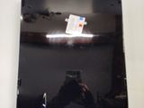 someone is taking a picture of themselves in the mirror of a car