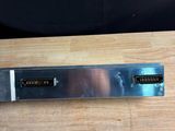 a knife that is sitting on top of a wooden table