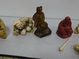 a lot of small figurines that are on a table