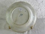 a white plate with a blue and white design on it