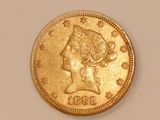 an image of a gold coin with a woman ' s head on it