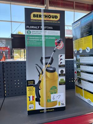 a yellow spray can sitting on a shelf in a store