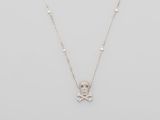 a necklace with a skull and crossbone pendant on a chain