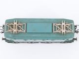 a blue train car that is sitting on the tracks